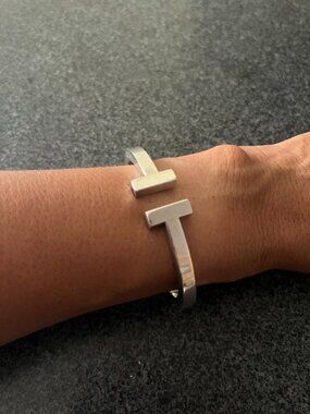 Tiffany & Co. sterling silver T cuff hinged bangle bracelet, marked © Tiffany &